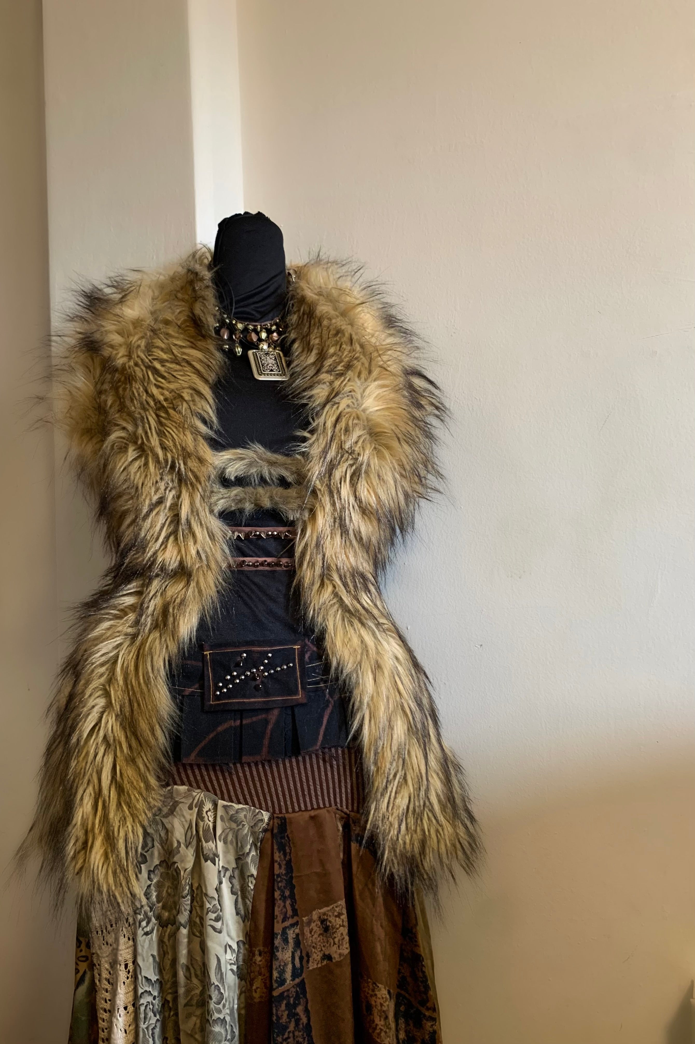 Not your average top.
Heavy luxury faux fur, corset-boned sides for structure, made to sculpt the body.