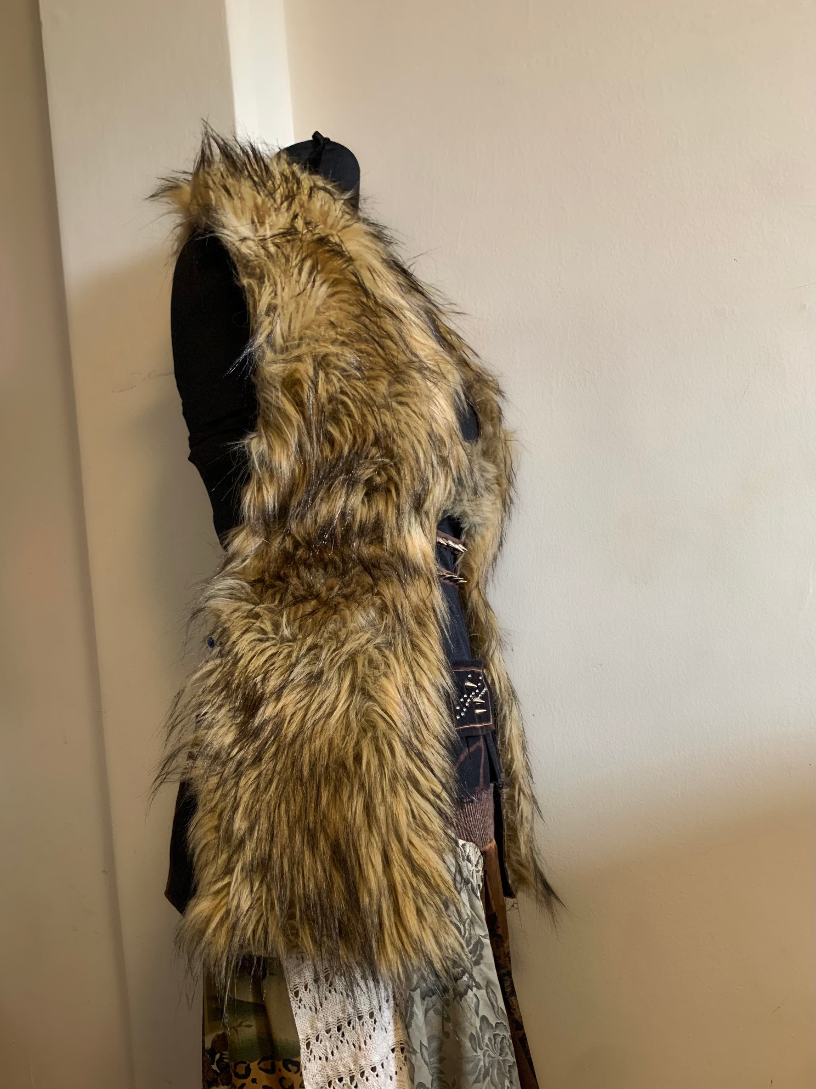 Not your average top.
Heavy luxury faux fur, corset-boned sides for structure, made to sculpt the body.