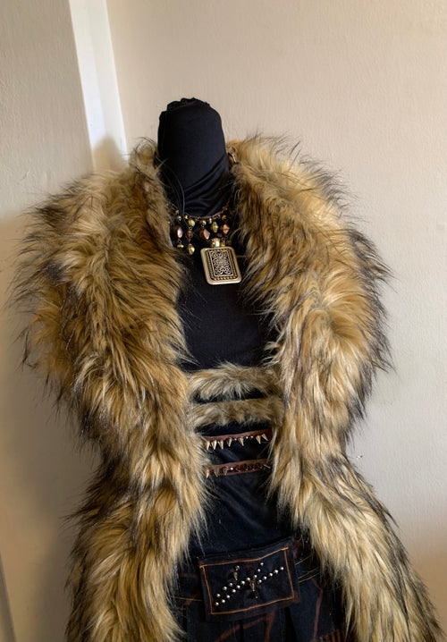 Not your average top.
Heavy luxury faux fur, corset-boned sides for structure, made to sculpt the body.